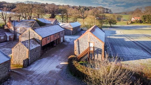 The exterior of 4 Cart Lodge Barn and neighbouring cottages, Norfolk